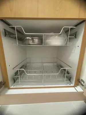 an empty refrigerator with empty shelves in a room at Field residences Building 9 in Manila