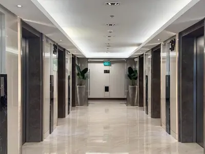 an empty hallway in a building with a hallwayngth at SMDC Coast Residences Levi & Moon in Manila