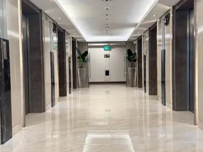 an empty hallway in a building with a hallwayngth at SMDC Coast Residences Levi & Moon in Manila