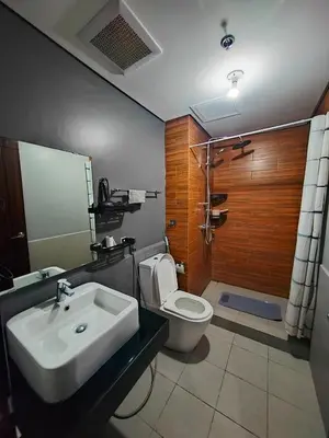 a bathroom with a sink and a toilet at Luxurious Haven in the Sky in Manila