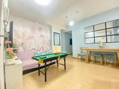 a living room with a ping pong table in it at Leisure escape Azure staycation in Manila