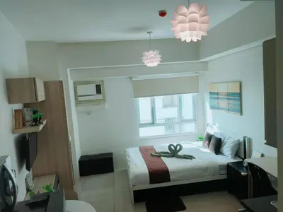 a bedroom with a bed with an octopus on it at The Catalina at The Beacon Makati in Manila