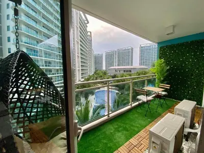 a balcony with a view of a city at Leisure escape Azure in Manila