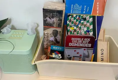 a drawer filled with books and a toy telephone at Leisure escape Azure in Manila