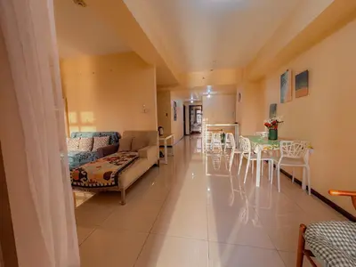 a living room with a couch and a table at The Radiance Manila bay 2BR in Manila