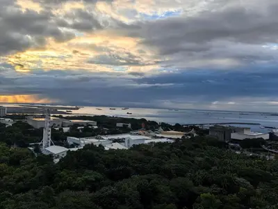 a view of a city with boats in the water at Seaside Sanctuary and Beach Vibes in Manila