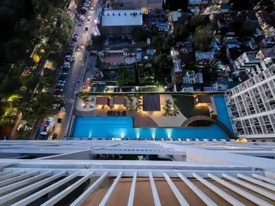 a view from the top of a building at night at Seaside Sanctuary and Beach Vibes in Manila