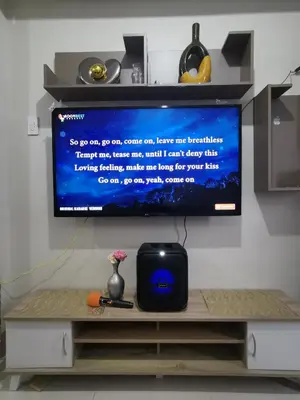 a flat screen tv sitting on top of a table at Aldo Staycation mall of Asia in Manila