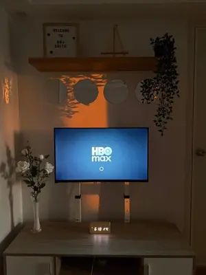 a flat screen tv sitting on top of a table at BnJ Suite Urban Deca w Netflix, Max, YT Premium, FREE parking in Manila
