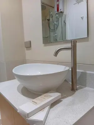 a white bowl sink on a counter in a bathroom at Condo in Pasay 12th flr studio unit-near MOA, PICC in Manila