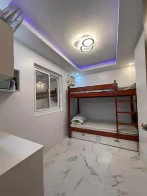 a room with bunk beds in a kitchen with a ceiling at Casa MiKulai