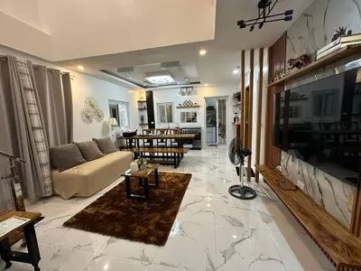 a living room with a couch and a tv at Casa MiKulai