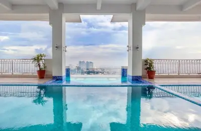 a swimming pool on the roof of a building at EK's Place in Manila