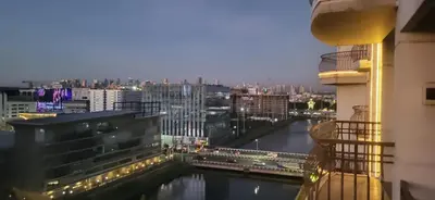 a view of a river from a building at Solemare Parksuites with balcony in Manila
