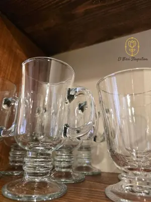 three clear glass glasses sitting on a wooden table at El Nissi Staycation, THE DELUXE CABIN, Enchanted Kingdom in Santa Rosa