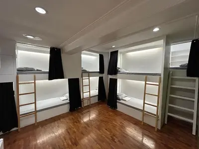 a room with four bunk beds in it at Manila Gateway Hostel in Manila