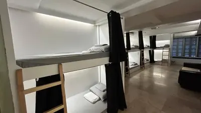 a group of bunk beds in a room at Manila Gateway Hostel in Manila