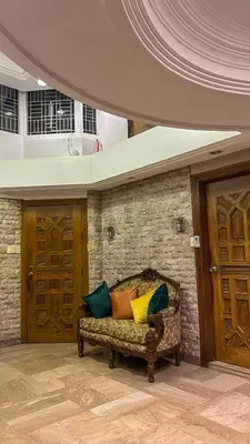 a couch with colorful pillows on it in a room at Manila Gateway Hostel in Manila