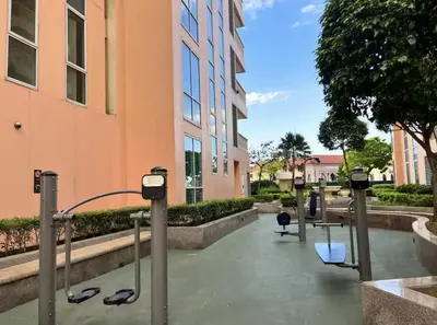 a row of parking meters in front of a building at Classy Venice Grand Studio Balcony Pet friendly, WiFi & Pool in Manila