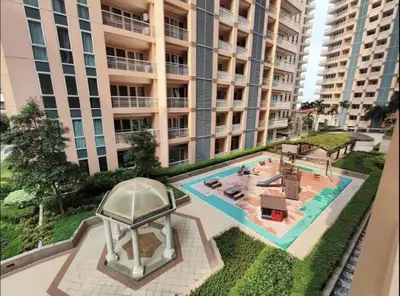 an apartment building with a pool and a gazebo at Classy Venice Grand Studio Balcony Pet friendly, WiFi & Pool in Manila