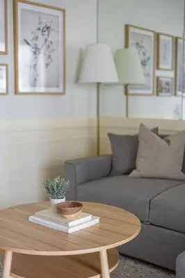 a living room with a couch and a coffee table at 2 BR Golf View Loft Timeless Charm in Avant BGC in Manila