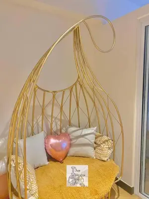 a metal bed with a heart on top of it at Staycation by Darvy in Manila