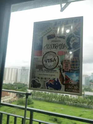 a sign on a window with stickers on it at Aldo mall of Asia condotel in Manila