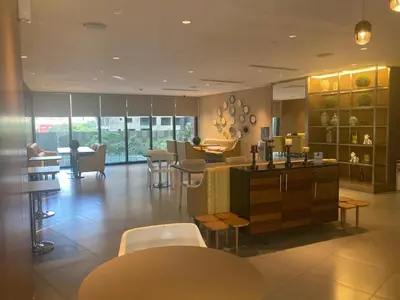 a restaurant with tables and chairs in a room at 56th Floor -Sauna - Makati View - Knightsbridge Residences in Manila