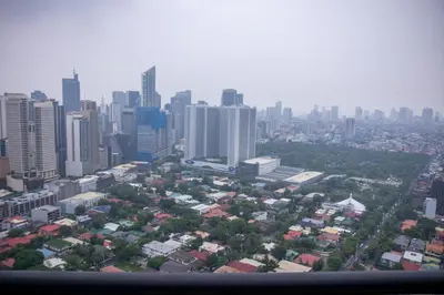 an aerial view of a city with tall buildings at C-Studio,Best Sunset Pool,Luxury,Hotel Style in Manila