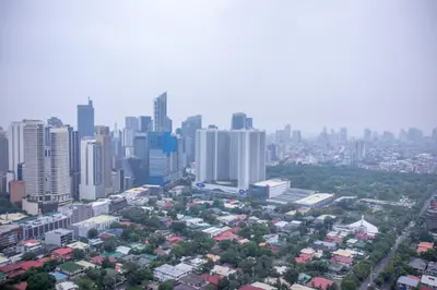 an aerial view of a city with tall buildings at C-Studio,Best Sunset Pool,Luxury,Hotel Style in Manila
