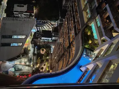 an overhead view of a pool in a city at night at D-Studio,Best Sunset Pool,Luxury,Hotel Style in Manila