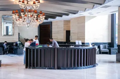 a group of people standing around a bar in a lobby at D-Studio,Best Sunset Pool,Luxury,Hotel Style in Manila