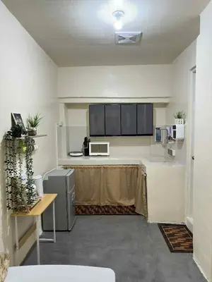a kitchen with a counter in a room at Canlubang Transient house Asia 1 near 7-11 in Calamba