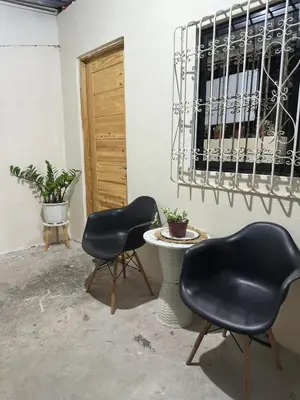 two chairs and a table in a room at Canlubang Transient house Asia 1 near 7-11 in Calamba