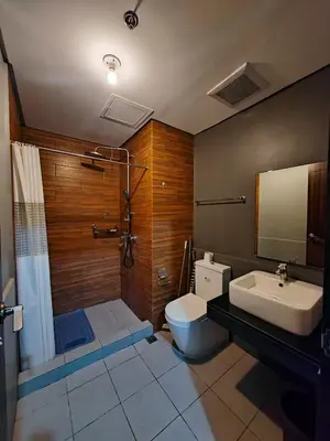 a bathroom with a toilet and a sink at LeMoon's Chill with beautiful view-1 Bedroom in Manila