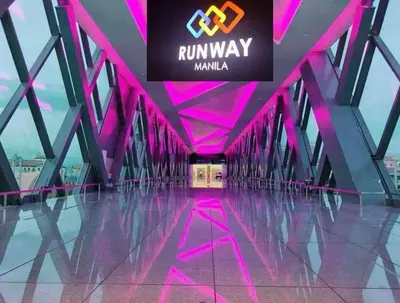 a hallway with pink lighting in a building at Lovely Condo Across NAIA T3 Newport with WiFi in Manila