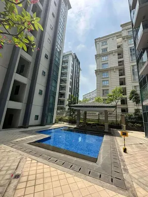 a swimming pool with a gazebo and buildings at Lovely Condo Across NAIA T3 Newport with WiFi in Manila