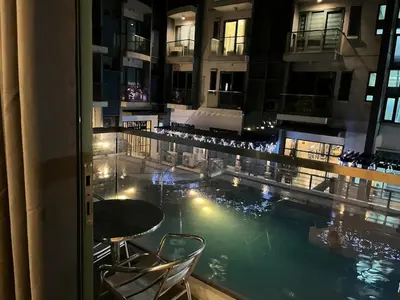 a view of a pool from a hotel room at Kyendenz Condotel-Across Naia T3 Pool View with Wifi in Manila