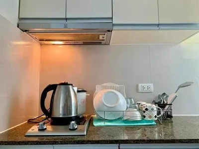a kitchen counter with a tea kettle and other appliances at Staycation Unit at Two Palm Across Naia T3 with WIFI in Manila
