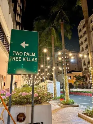 a green sign that reads two palms tree villas at Staycation Unit at Two Palm Across Naia T3 with WIFI in Manila