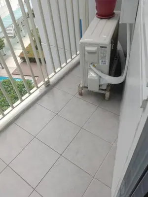 a room with a heater on a balcony at Luxurious Condo in the Heart of Makati Philippines in Manila