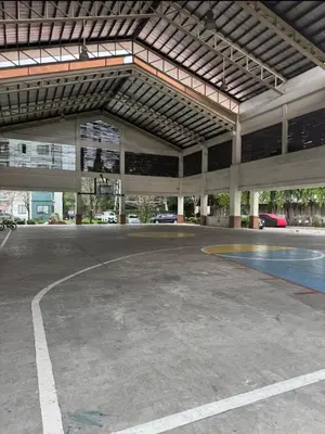 an empty basketball court inside of a building at MetacasaStaycations-beside EK with Fireworks view in Santa Rosa