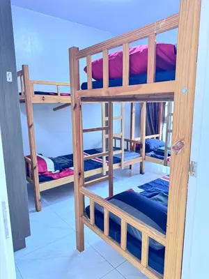 a group of bunk beds in a room at Near Moa Facing pool view WP1603 Monarch Parksuites in Manila