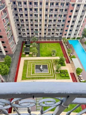 a view from the balcony of a building with a garden at Near Moa Facing pool view WP1603 Monarch Parksuites in Manila