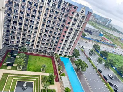 an aerial view of a large apartment building at Near Moa Facing pool view WP1603 Monarch Parksuites in Manila