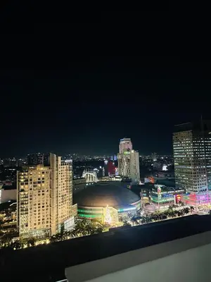 a view of a city skyline at night at Chill Luxe Vista in Manila