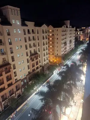 an aerial view of a street at night with buildings at Affordable Condoatel Hotel Near Naia 1,2,34 in Manila