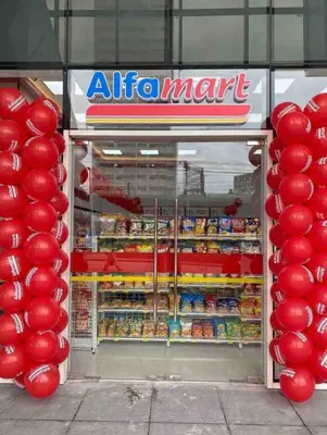 an open refrigerator with red balloons in front of it at Fame Residences One-Bedroom Condo Unit in Manila