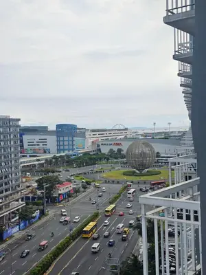 a busy city street with cars on a highway at MOA Shell Residences Spacious 1BR with City View WiFi and Netflix in Manila