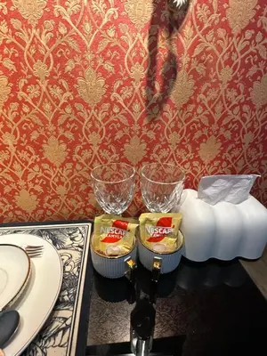 a table with three bowls and plates on a table at Vintage Luxx-Solemare Parksuites Free Pool Access! in Manila